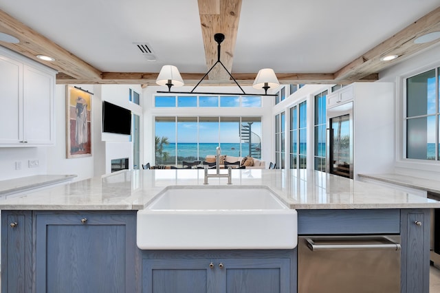 40 Jasmine Cir, Santa Rosa Beach, FL 32459 - kitchen with a sink, beamed ceiling, light stone countertops, decorative light fixtures, and open floor plan