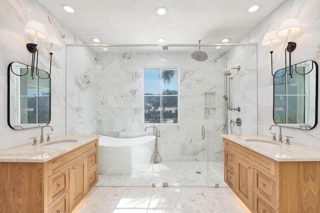 40 Jasmine Cir, Santa Rosa Beach, FL 32459 - full bath with a marble finish shower, two vanities, a soaking tub, recessed lighting, and tile walls