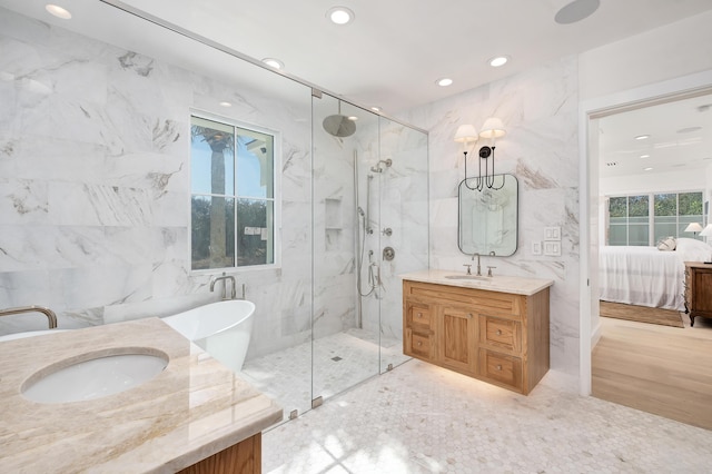 40 Jasmine Cir, Santa Rosa Beach, FL 32459 - full bath featuring tile walls, a marble finish shower, vanity, ensuite bath, and a freestanding bath