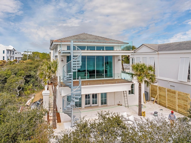40 Jasmine Cir, Santa Rosa Beach, FL 32459 - rear view of property with stairway, a patio area, and stucco siding