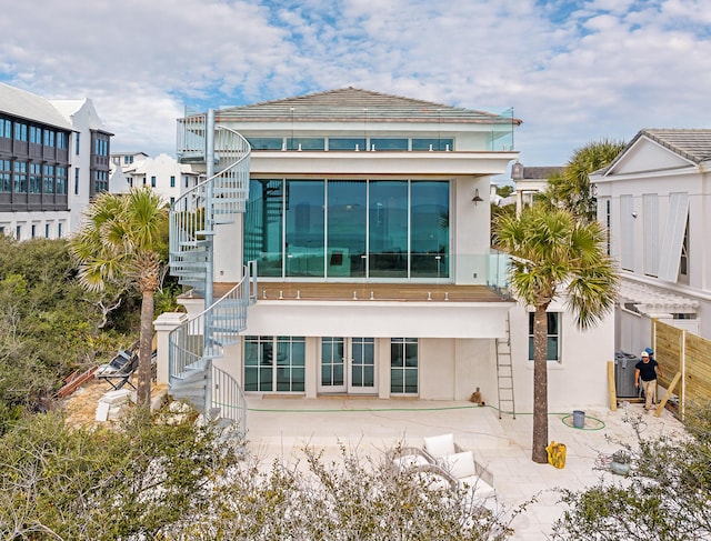 40 Jasmine Cir, Santa Rosa Beach, FL 32459 - rear view of house featuring stairs, a patio, central air condition unit, and stucco siding