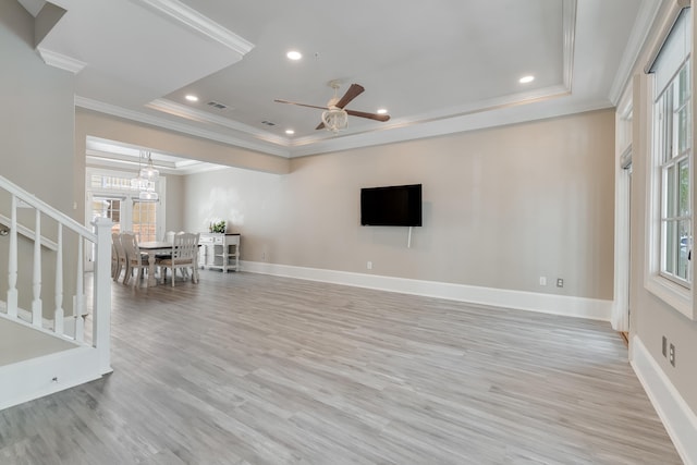 4134 Cobalt Cir Unit Ro14, Panama City, FL 32408 - living room with a raised ceiling, ornamental molding, ceiling fan, healthy amount of natural light, and light wood-style flooring