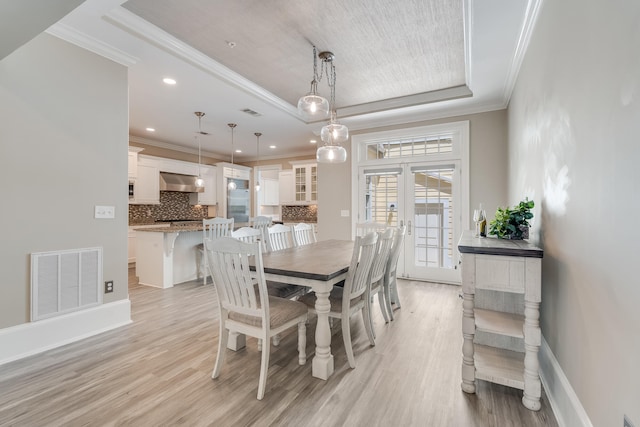 4134 Cobalt Cir Unit Ro14, Panama City, FL 32408 - dining room with a tray ceiling, light wood finished floors, ornamental molding, baseboards, and recessed lighting