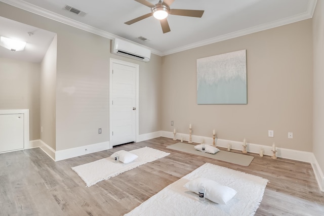 4134 Cobalt Cir Unit Ro14, Panama City, FL 32408 - unfurnished room with an AC wall unit, wood finished floors, ceiling fan, crown molding, and baseboards