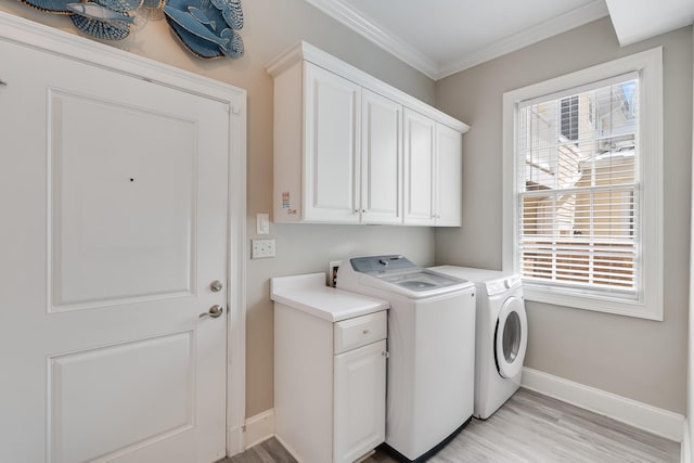 4134 Cobalt Cir Unit Ro14, Panama City, FL 32408 - laundry room featuring cabinet space, washing machine and dryer, baseboards, crown molding, and light wood-style floors
