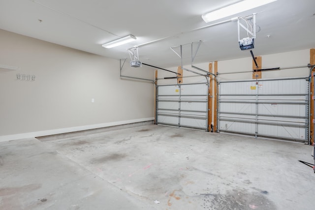 4134 Cobalt Cir Unit Ro14, Panama City, FL 32408 - garage featuring a garage door opener and baseboards
