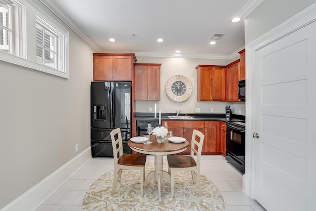 4134 Cobalt Cir Unit Ro14, Panama City, FL 32408 - kitchen featuring black appliances, a sink, ornamental molding, dark countertops, and recessed lighting