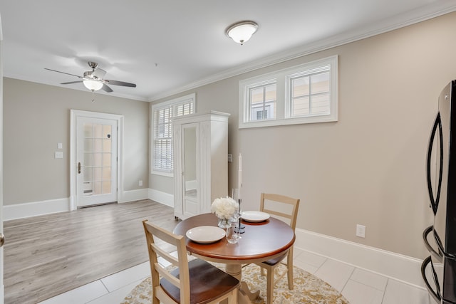 4134 Cobalt Cir Unit Ro14, Panama City, FL 32408 - dining area featuring ceiling fan, crown molding, baseboards, and light tile patterned flooring