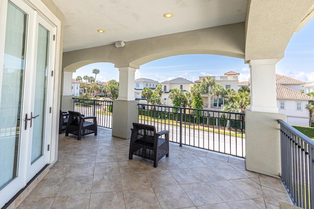 52 Tranquility Ln, Destin, FL 32541 - view of patio with a balcony, a residential view, and french doors