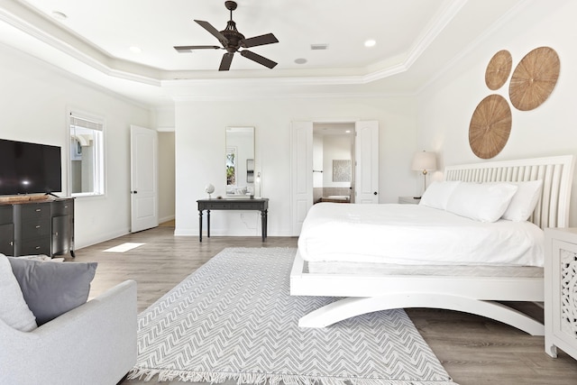 52 Tranquility Ln, Destin, FL 32541 - bedroom with a raised ceiling, wood finished floors, crown molding, ensuite bathroom, and recessed lighting