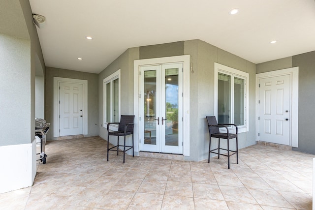 52 Tranquility Ln, Destin, FL 32541 - entrance to property featuring french doors and stucco siding