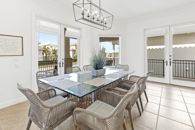 52 Tranquility Ln, Destin, FL 32541 - dining area with french doors, crown molding, a chandelier, and baseboards