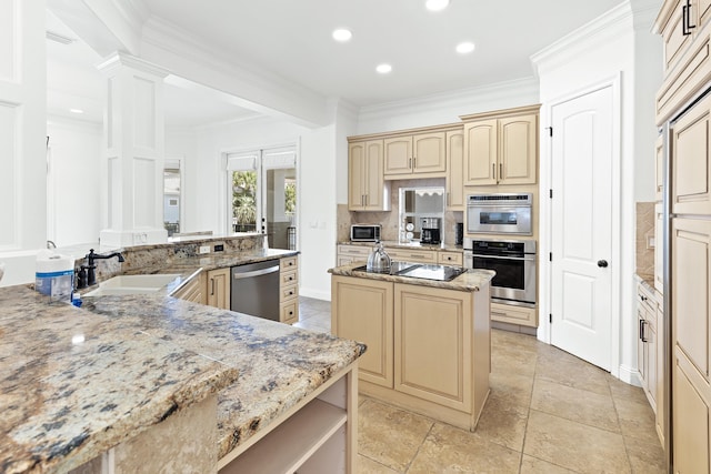 52 Tranquility Ln, Destin, FL 32541 - kitchen with dishwasher, a center island, a sink, ornate columns, and tasteful backsplash