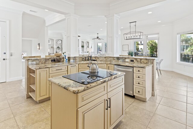 52 Tranquility Ln, Destin, FL 32541 - kitchen featuring stainless steel dishwasher, cream cabinets, decorative columns, a kitchen island, and black electric cooktop