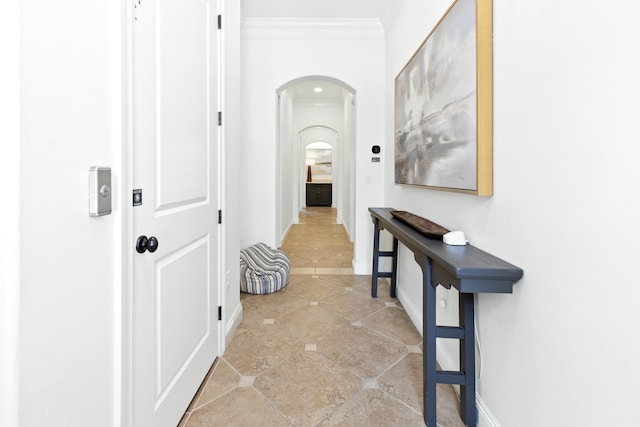 52 Tranquility Ln, Destin, FL 32541 - hallway featuring arched walkways, crown molding, baseboards, and tile patterned flooring