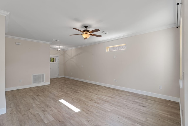 1511 23rd St, Niceville, FL 32578 - spare room with crown molding, a ceiling fan, baseboards, and light wood-type flooring