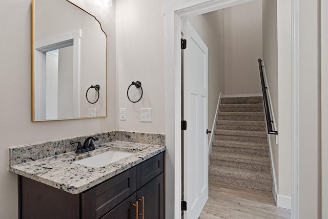 1511 23rd St, Niceville, FL 32578 - bathroom with vanity and wood finished floors