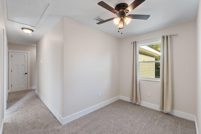 1511 23rd St, Niceville, FL 32578 - spare room with attic access, light carpet, ceiling fan, and baseboards