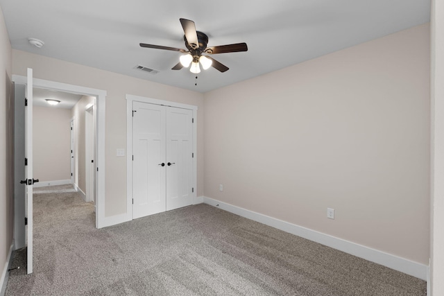 1511 23rd St, Niceville, FL 32578 - unfurnished bedroom with carpet, baseboards, a closet, and a ceiling fan