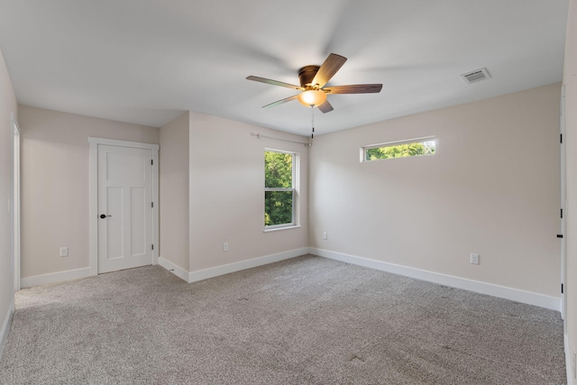 1511 23rd St, Niceville, FL 32578 - carpeted empty room with ceiling fan and baseboards