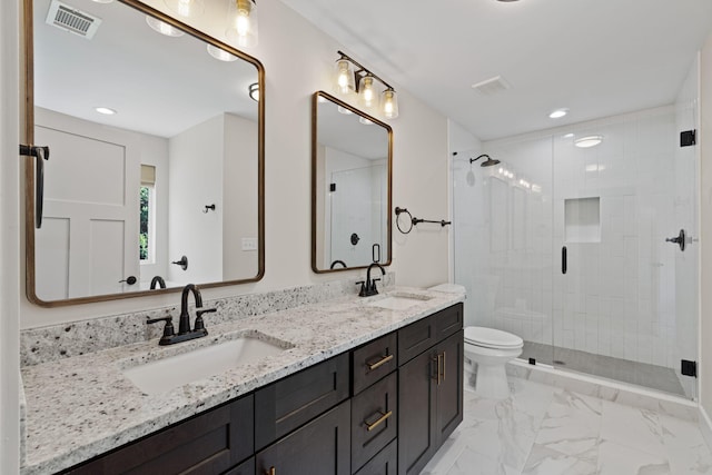 1511 23rd St, Niceville, FL 32578 - full bath featuring double vanity, a stall shower, toilet, recessed lighting, and marble look tiles