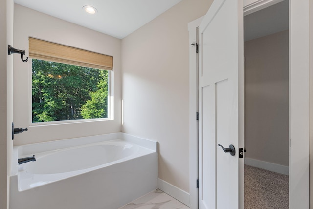 1511 23rd St, Niceville, FL 32578 - full bathroom featuring a garden tub, baseboards, marble finish floors, and recessed lighting