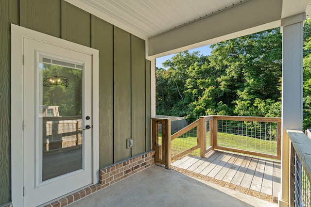 1511 23rd St, Niceville, FL 32578 - property entrance featuring board and batten siding and a deck
