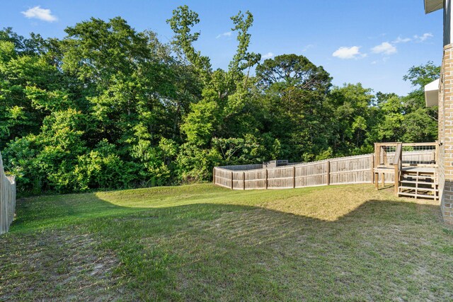 1511 23rd St, Niceville, FL 32578 - view of yard featuring a wooden deck