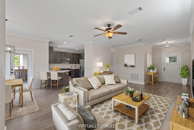 1511 23rd St, Niceville, FL 32578 - living room featuring plenty of natural light, light wood-style floors, baseboards, ceiling fan, and recessed lighting