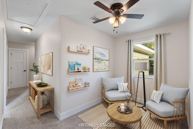 1511 23rd St, Niceville, FL 32578 - sitting room with attic access, ceiling fan, baseboards, and carpet
