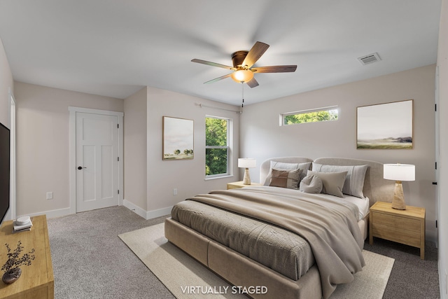 1511 23rd St, Niceville, FL 32578 - bedroom with carpet, baseboards, and ceiling fan