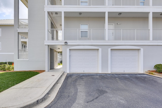 2410 Scenic Gulf Dr Unit 101C, Miramar Beach, FL 32550 - view of building exterior with a garage and driveway