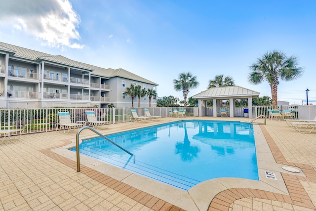 2410 Scenic Gulf Dr Unit 101C, Miramar Beach, FL 32550 - community pool featuring a gazebo and a patio