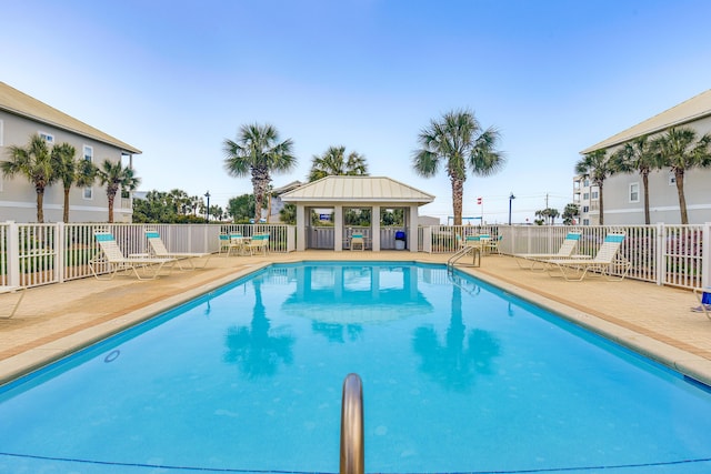 2410 Scenic Gulf Dr Unit 101C, Miramar Beach, FL 32550 - community pool with a gazebo and a patio area