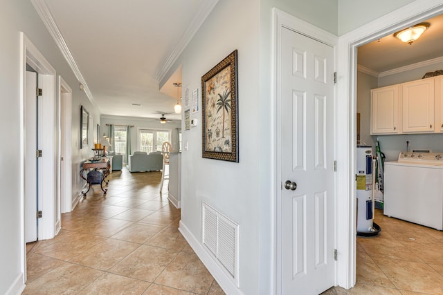 2410 Scenic Gulf Dr Unit 101C, Miramar Beach, FL 32550 - hallway with washer / clothes dryer, electric water heater, light tile patterned floors, ornamental molding, and baseboards