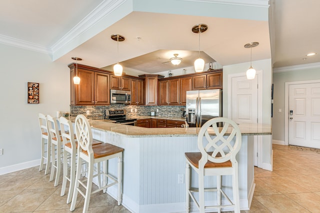 2410 Scenic Gulf Dr Unit 101C, Miramar Beach, FL 32550 - kitchen with stainless steel appliances, ornamental molding, a breakfast bar area, light tile patterned flooring, and a peninsula