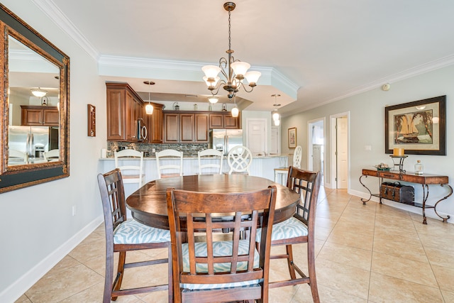 2410 Scenic Gulf Dr Unit 101C, Miramar Beach, FL 32550 - dining area with crown molding, light tile patterned floors, baseboards, and a chandelier