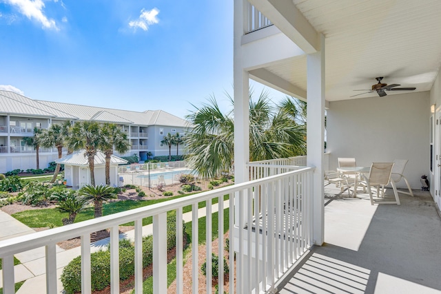 2410 Scenic Gulf Dr Unit 101C, Miramar Beach, FL 32550 - balcony with ceiling fan and outdoor dining area
