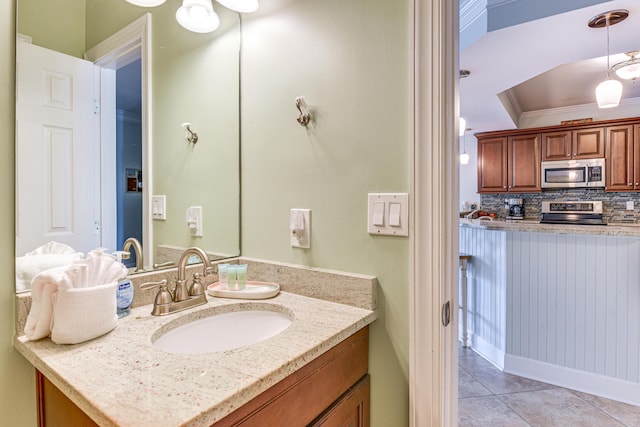 2410 Scenic Gulf Dr Unit 101C, Miramar Beach, FL 32550 - bathroom with vanity, tasteful backsplash, tile patterned floors, and ornamental molding