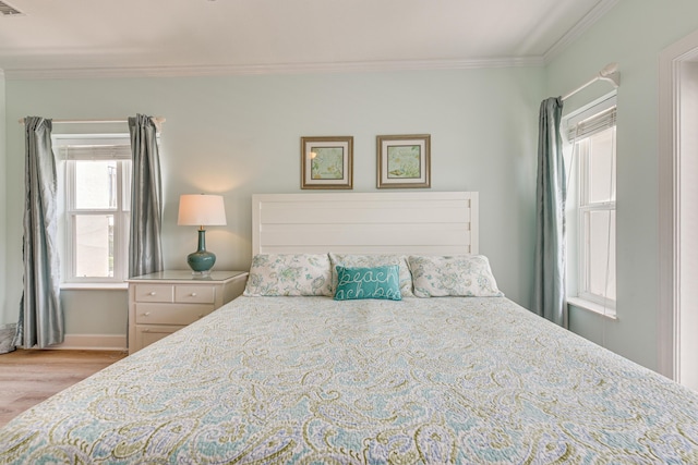 2410 Scenic Gulf Dr Unit 101C, Miramar Beach, FL 32550 - bedroom featuring crown molding, wood finished floors, and baseboards