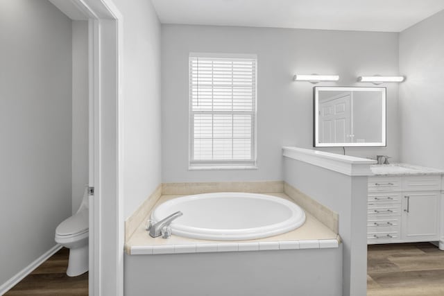 518 Second Ave, Destin, FL 32541 - bathroom featuring wood finished floors, a garden tub, and vanity