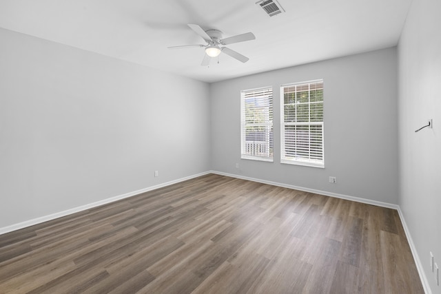 518 Second Ave, Destin, FL 32541 - spare room featuring wood finished floors, baseboards, and a ceiling fan