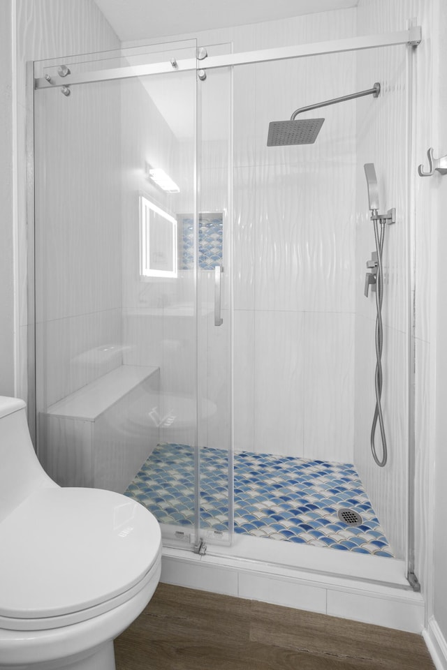 518 Second Ave, Destin, FL 32541 - bathroom featuring toilet, a stall shower, and wood finished floors