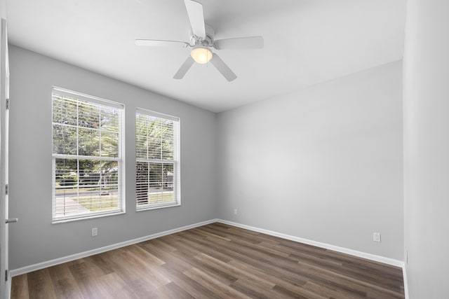518 Second Ave, Destin, FL 32541 - empty room with dark wood-type flooring, baseboards, and ceiling fan