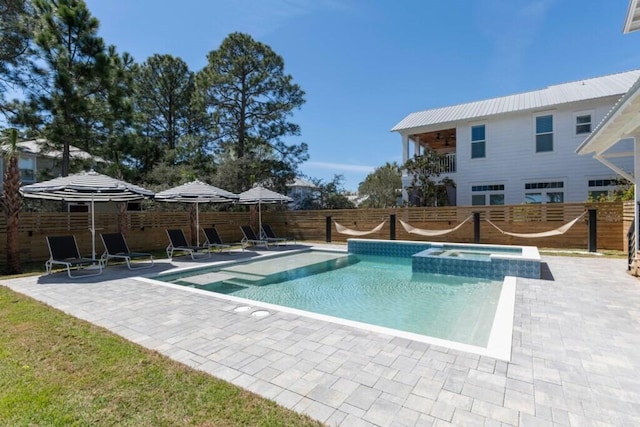 136 Lee Pl, Santa Rosa Beach, FL 32459 - view of pool with a fenced backyard, a patio area, and a pool with connected hot tub