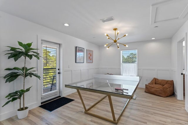136 Lee Pl, Santa Rosa Beach, FL 32459 - recreation room with light wood-style floors, a decorative wall, a wainscoted wall, recessed lighting, and a chandelier