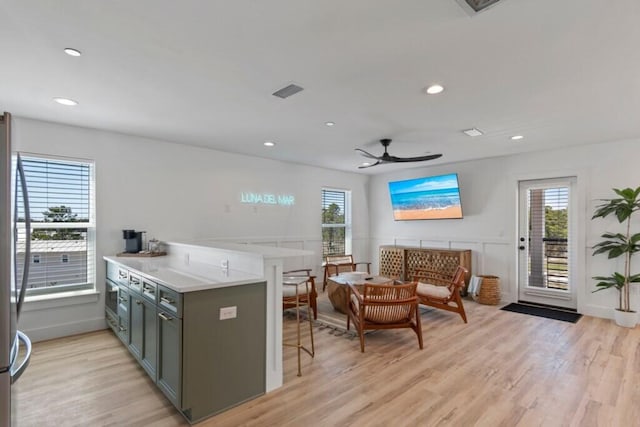136 Lee Pl, Santa Rosa Beach, FL 32459 - kitchen with light wood-style flooring, ceiling fan, a breakfast bar area, recessed lighting, and light countertops