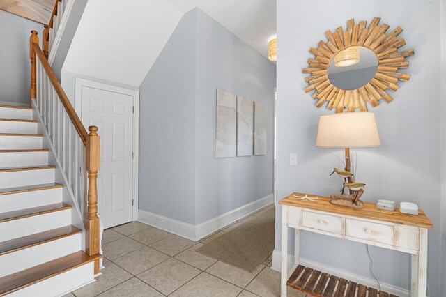 431 La Valencia Cir, Panama City Beach, FL 32413 - stairway with tile patterned flooring and baseboards