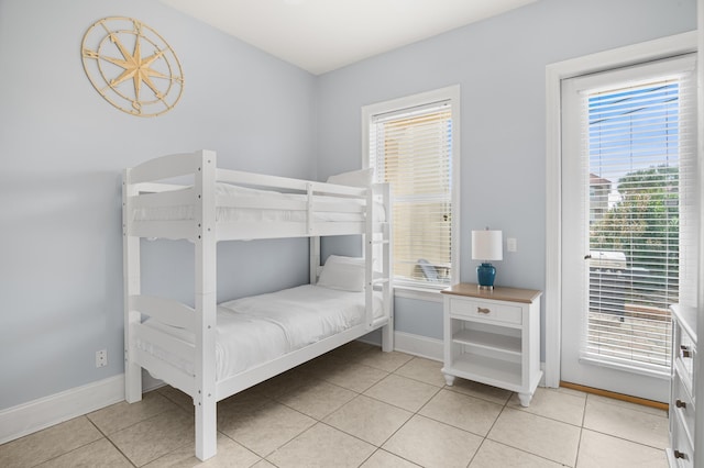 431 La Valencia Cir, Panama City Beach, FL 32413 - bedroom with baseboards and light tile patterned floors