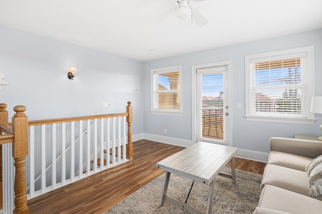 431 La Valencia Cir, Panama City Beach, FL 32413 - living area featuring wood finished floors, baseboards, and a ceiling fan
